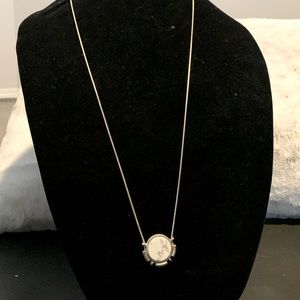 Long faux gold and marble fashion necklace.